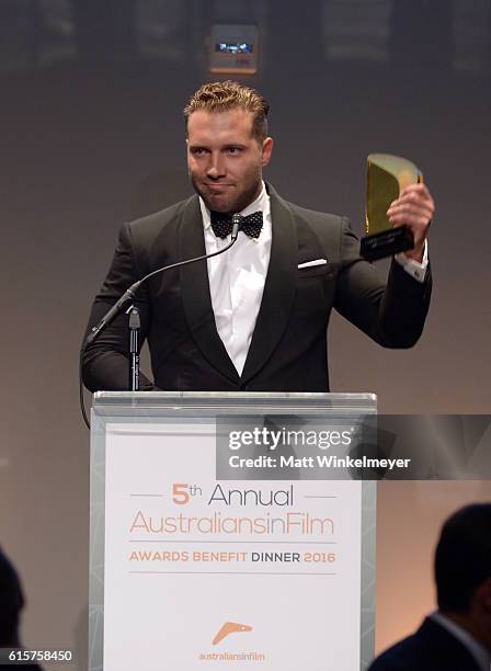 Actor Jai Courtney accepts the FOXTEL Breakthrough Award onstage during Australians In Film's 5th Annual Awards Gala at NeueHouse Hollywood on...