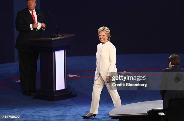 Hillary Clinton, 2016 Democratic presidential nominee, walks on stage as Donald Trump, 2016 Republican presidential nominee, left, and moderator...