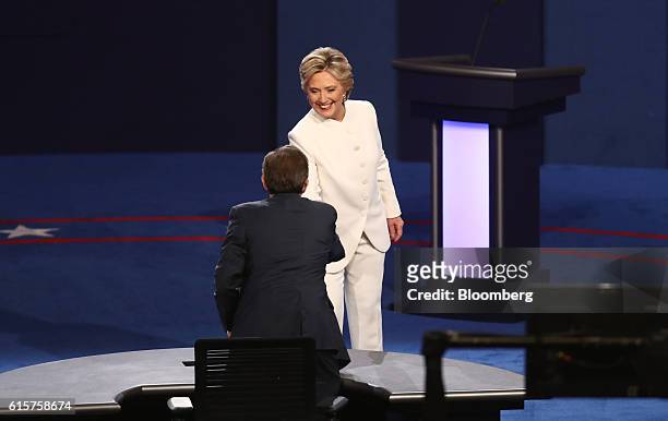 Hillary Clinton, 2016 Democratic presidential nominee, shakes hands with moderator Chris Wallace after the third U.S. Presidential debate in Las...