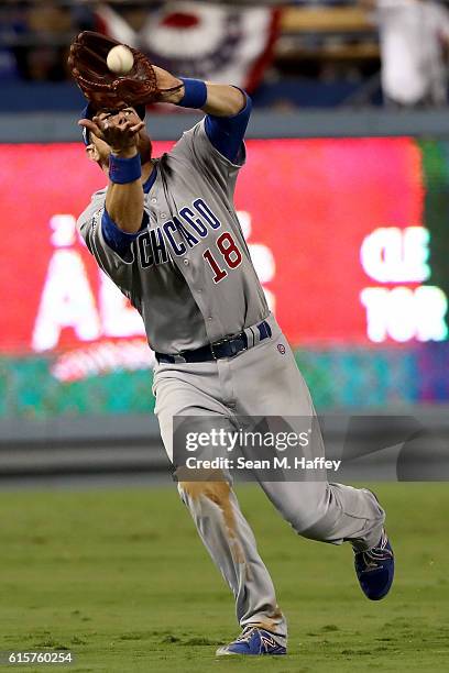 Ben Zobrist of the Chicago Cubs makes a catch in the seventh inning against the Los Angeles Dodgers in game four of the National League Championship...