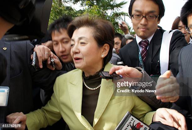 Japan - Shiga Gov. Yukiko Kada is surrounded by reporters in Otsu, Shiga Prefecture, on Nov. 28, 2012. The governor announced the previous day her...