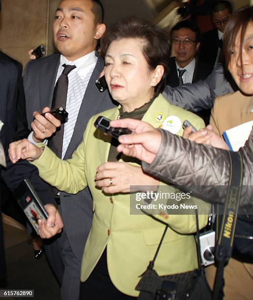 Japan - Shiga Gov. Yukiko Kada is surrounded by reporters in Otsu, Shiga Prefecture, on Nov. 28, 2012. The governor announced the previous day her...