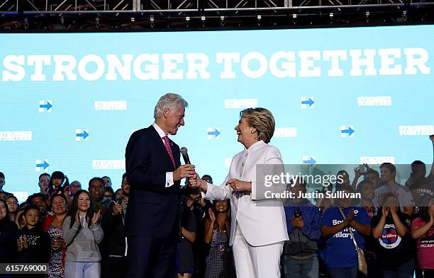 Democratic presidential nominee Hillary Clinton and her husband former U.S. President Bill Clinton speak during a debate watch party at Craig Ranch...