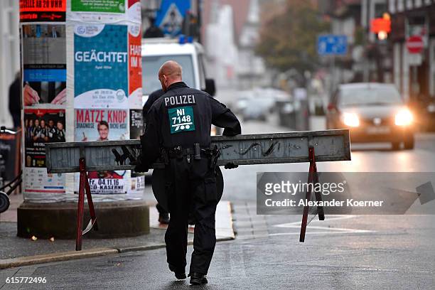 Policeman sets up a barricade outside the Oberlandesgericht Celle courthouse ahead of the first day of the trial aginst Safia S. On October 20, 2016...