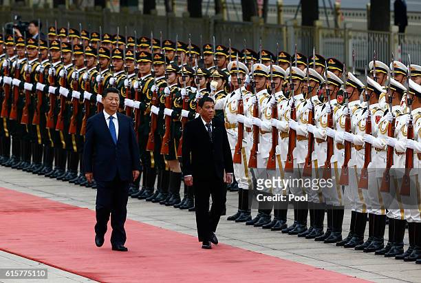 President of the Philippines Rodrigo Duterte and Chinese President Xi Jinping review the honor guard as they attend a welcoming ceremony at the Great...