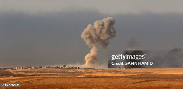 Smoke billows from an area near the Iraqi town of Bashiqa, some 25 kilometres north east of Mosul, on October 20 during an operation against Islamic...