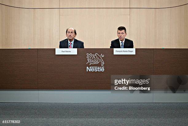 Paul Bulcke, chief executive officer of Nestle SA, left, and Francois-Xavier Roger, chief financial officer of Nestle SA, attend a news conference to...