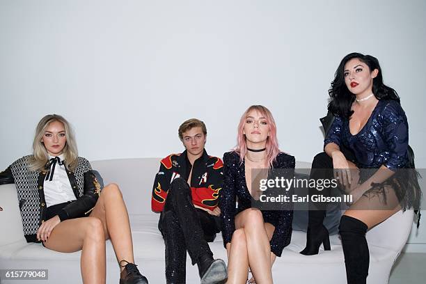 Members of the band The Atomics Daisy Smith, Lucky Blue Smith, Pyper America Smith and Starlie Smith pose for a photo before theri performance at The...