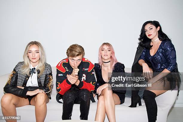 Members of the band The Atomics Daisy Smith, Lucky Blue Smith, Pyper America Smith and Starlie Smith pose for a photo before theri performance at The...