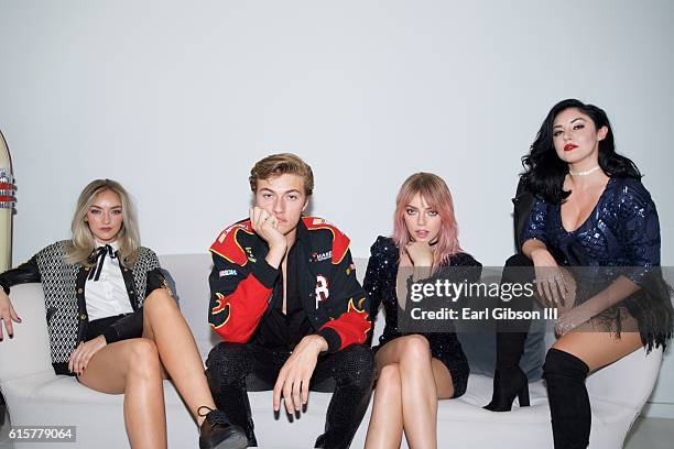 Members of the band The Atomics Daisy Smith, Lucky Blue Smith, Pyper America Smith and Starlie Smith pose for a photo before theri performance at The...