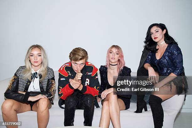 Members of the band The Atomics Daisy Smith, Lucky Blue Smith, Pyper America Smith and Starlie Smith pose for a photo before theri performance at The...