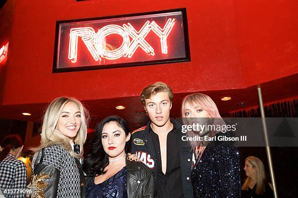 Daisy Smith, Starlie Smith, Lucky Blue Smith and Pyper America Smith members of The Atomics pose for a photo before their performance at The Roxy...