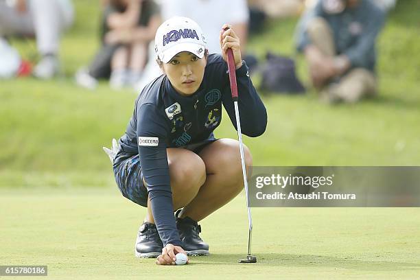 Ritsuko Ryu of Japan lines up her putt on the 18th green during the first round of the Nobuta Group Masters GC Ladies at the Masters Golf Club on...