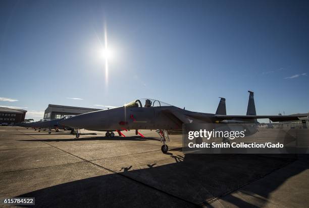 Clear skies and bright sun shines down on a row of 125th Fighter Wing F-15s from Jacksonville Fla. On the Eglin Air Force Base flightline Oct. 7,...
