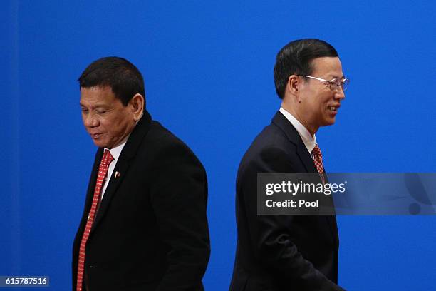 Chinese Vice-Premier Zhang Gaoli walks passing by Philippines President Rodrigo Duterte after he made a speech during the Philippines - China Trade...