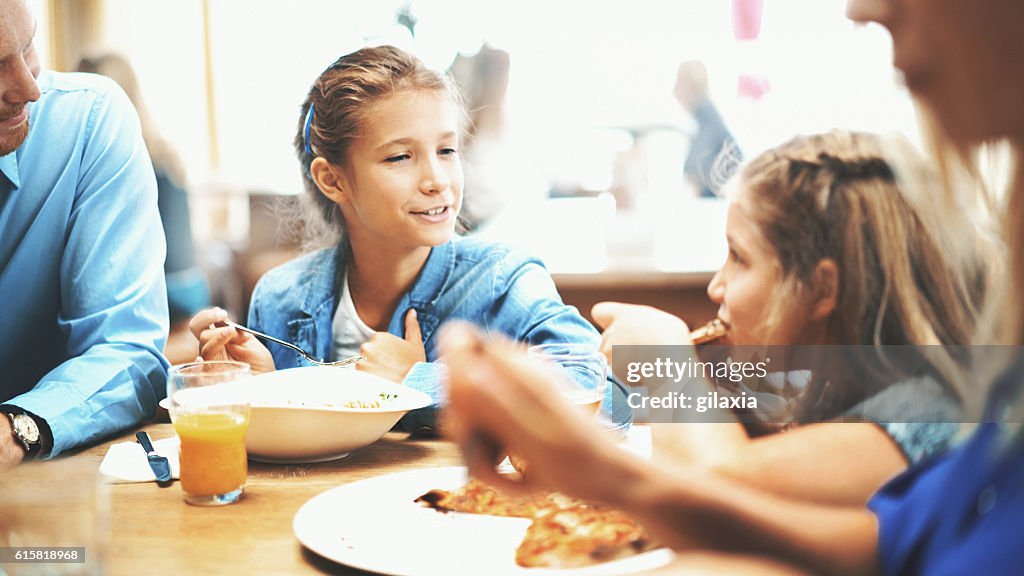 Family having lunch in a restaurant.