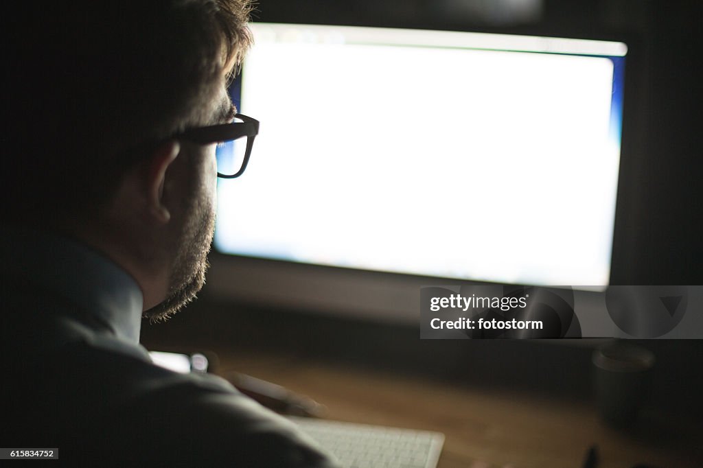 Man looking at computer monitor