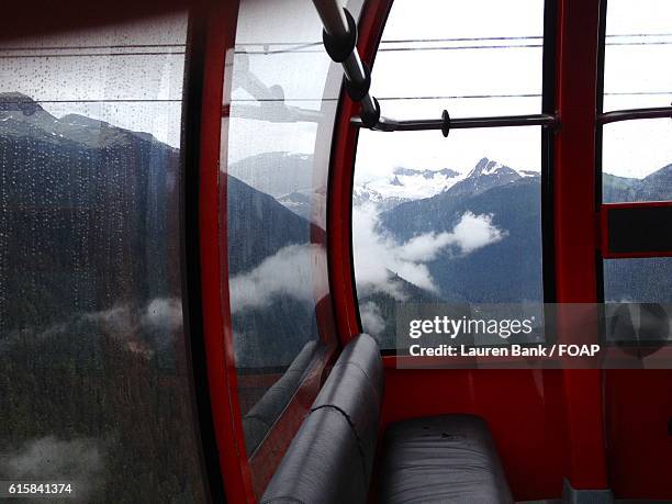 view of mountains from cable car - lauren glassberg stock-fotos und bilder