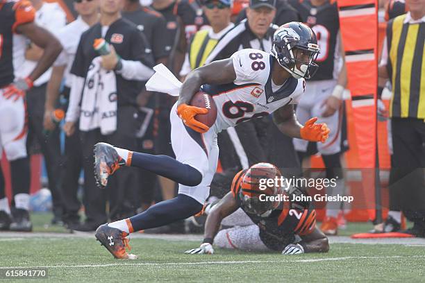 Demaryius Thomas of the Denver Broncos runs the football upfield against Darqueze Dennard of the Cincinnati Bengals at Paul Brown Stadium on...