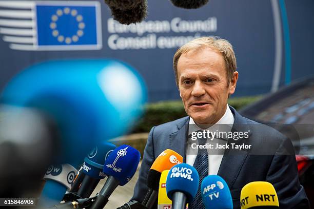 President of the European Council Donald Tusk addresses assembled media as he arrives at the Council of the European Union on the first day of a two...