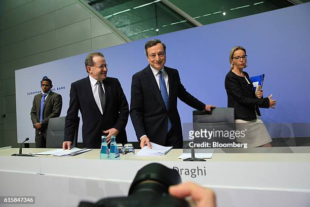 Mario Draghi, president of the European Central Bank , center, pauses Vitor Constancio, vice president of the European Central Bank, second left, and...