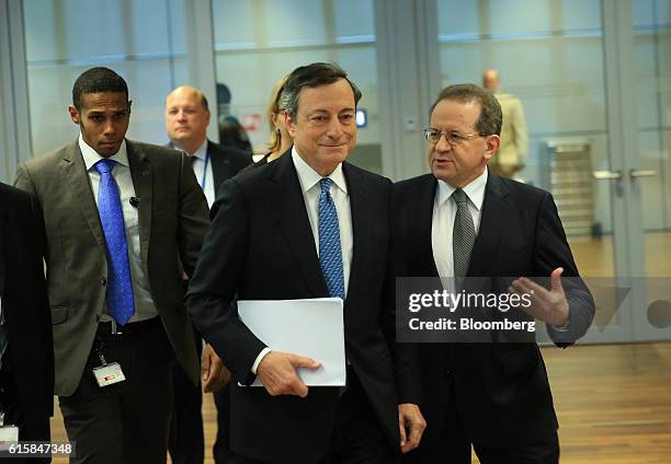 Mario Draghi, president of the European Central Bank , center, and Vitor Constancio, vice president of the European Central Bank, right, arrive for a...