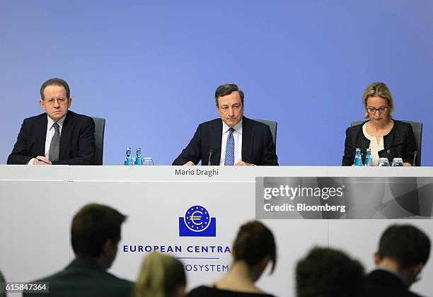 Mario Draghi, president of the European Central Bank , center, pauses Vitor Constancio, vice president of the European Central Bank, left, and...