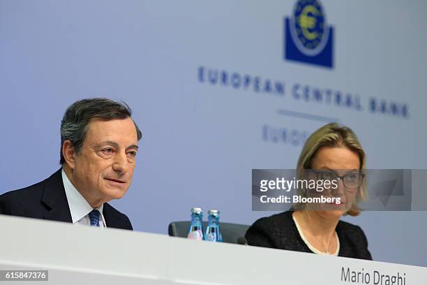 Mario Draghi, president of the European Central Bank , left, speaks as he sits beside Christine Graeff, director general for communications at the...