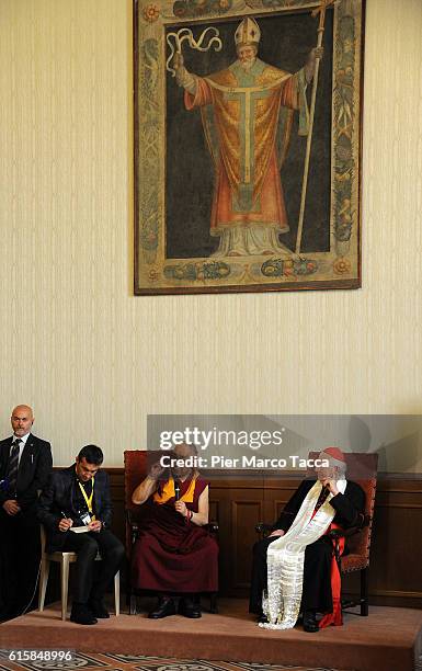 Dalai Lama gestures with Milan Archibishop Angelo Scola during a meeting with the Archbishop on October 20, 2016 in Milan, Italy. The Dalai Lama...