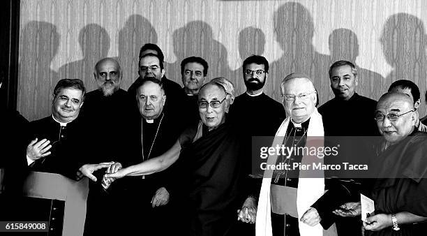 Dalai Lama, Milan Archibishop Angelo Scola and members of the delegation pose during a meeting with the Archbishop on October 20, 2016 in Milan,...