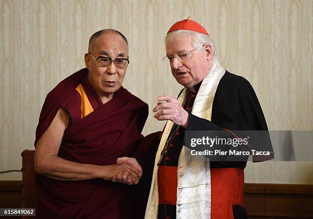 Dalai Lama shakes hands with Milan Archibishop Angelo Scola during a meeting with the Archbishop on October 20, 2016 in Milan, Italy. The Dalai Lama...