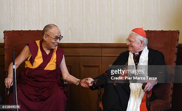 Dalai Lama gestures with Milan Archibishop Angelo Scola during a meeting with the Archbishop on October 20, 2016 in Milan, Italy. The Dalai Lama...