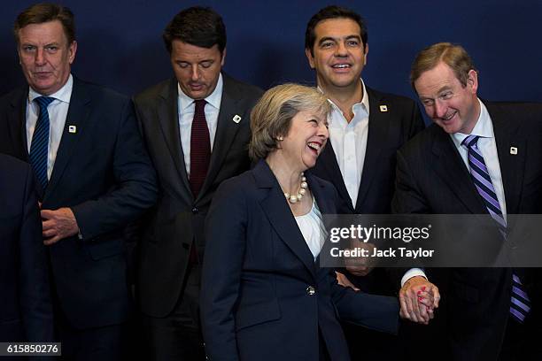 Italy's Prime minister Matteo Renzi Greece's Prime minister Alexis Tsipras look on as British Prime Minister Theresa May greets Irish Taoiseach Enda...