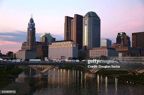 urban skyscrappers along scioto river, columbus, ohio, usa - columbus ohio aerial stock pictures, royalty-free photos & images