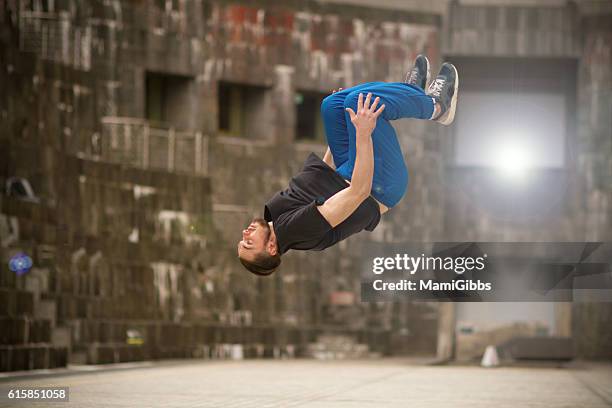 beautiful male dancer break-dancing on the street - backflipping imagens e fotografias de stock