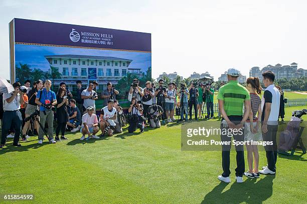 Li Haotong of China gives a clinic to golfers including Hong Kong model Karena Ng and singer Pakho Chau on the sidelines of World Celebrity Pro-Am...