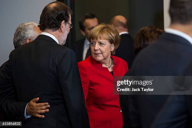 German Chancellor Angela Merkel pictured following a group photo with other leaders of European Union countries at the Council of the European Union...