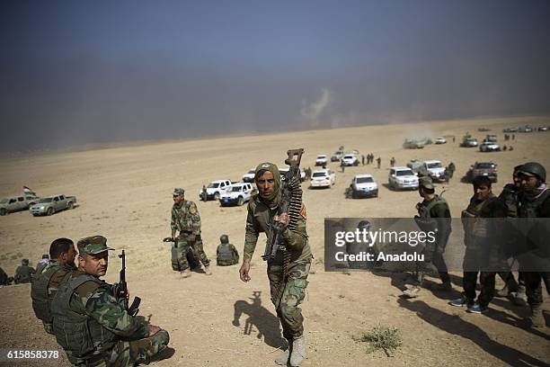 Iraqi Kurdish Regional Government's peshmerga forces move forward a position, located between Faziliya and Omar Vilalges to attack to capture Nawaran...