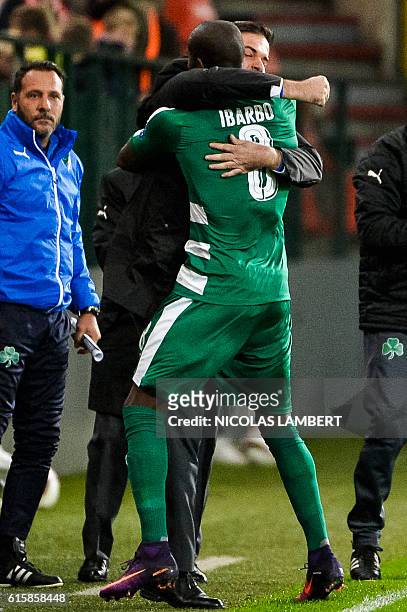 Panathinaikos' Colombian forward Victor Ibarbo celebrates with coach Andrea Stramaccioni after scoring a goal during the UEFA Europa League group G...