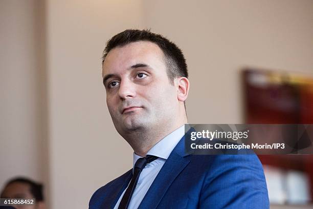 Vice President of far right National Front Florian Philippot looks at his political party leader Marine Le Pen, member of the European Parliament,...