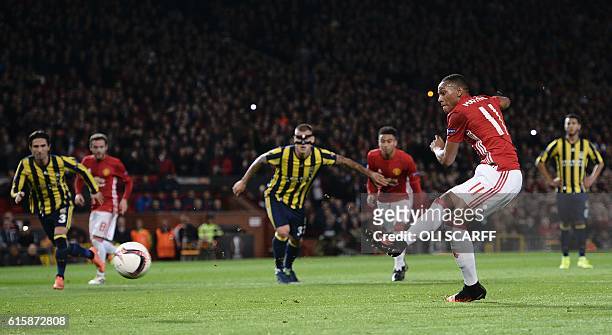 Manchester United's French striker Anthony Martial scores their second goal from the penalty spot during the UEFA Europa League group A football...