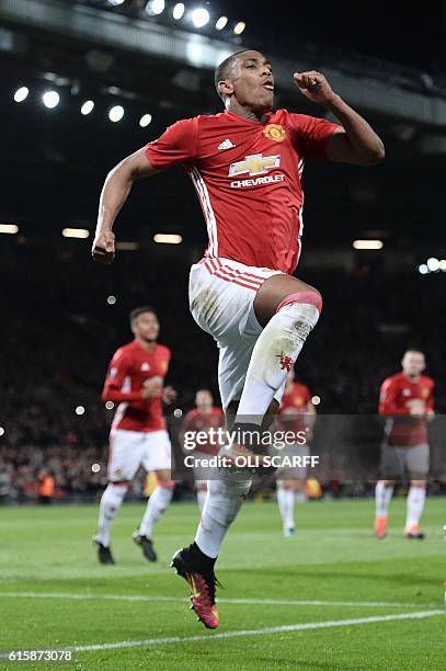 Manchester United's French striker Anthony Martial celebrates scoring their second goal from the penalty spot during the UEFA Europa League group A...