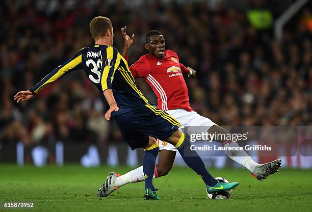 Roman Neustaedter of Fenerbahce and Paul Pogba of Manchester United battle for the ball during the UEFA Europa League Group A match between...