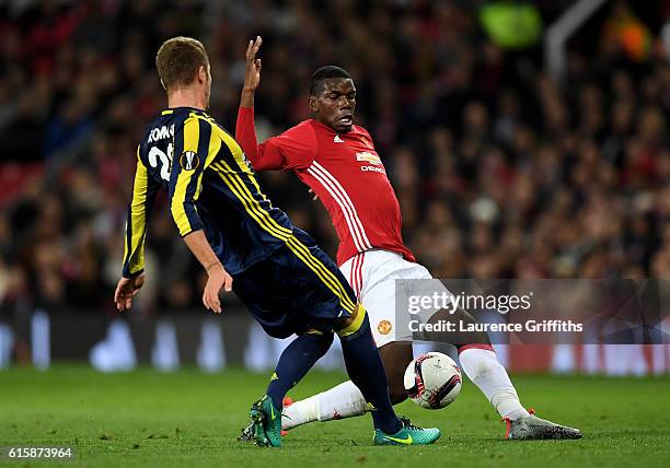 Roman Neustaedter of Fenerbahce and Paul Pogba of Manchester United battle for the ball during the UEFA Europa League Group A match between...