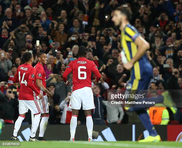 Paul Pogba of Manchester United celebrates scoring their first goal during the UEFA Europa League match between Manchester United FC and Fenerbahce...