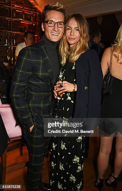Ollie Proudlock and Emma Louise Connolly attend the Tatler Little Black Book party with Polo Ralph Lauren at Restaurant Ours on October 20, 2016 in...