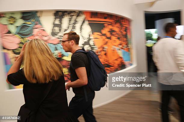 People visit the new Google pop-up shop in the SoHo neighborhood on October 20, 2016 in New York City. The shop lets people try out new Google...