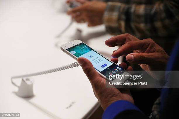 Person tries a new Google Pixel phone at the Google pop-up shop in the SoHo neighborhood on October 20, 2016 in New York City. The shop lets people...