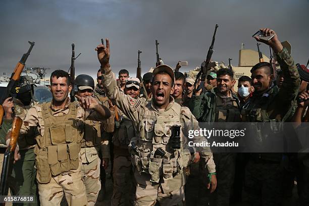 Soldiers of Iraqi Army shout slogans as they move forward Khalid, Saleh and Zanawer Villages from recaptured village Kabarok of Qayyarah Town to...