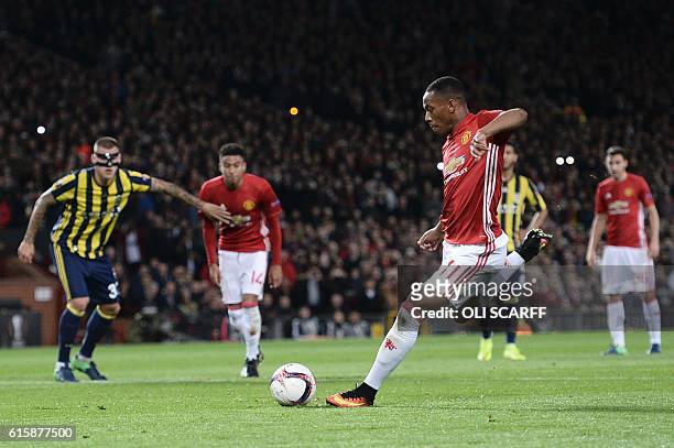 Manchester United's French striker Anthony Martial scores their second goal from the penalty spot during the UEFA Europa League group A football...